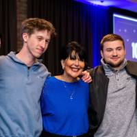 President Mantella smiles with a group of grads